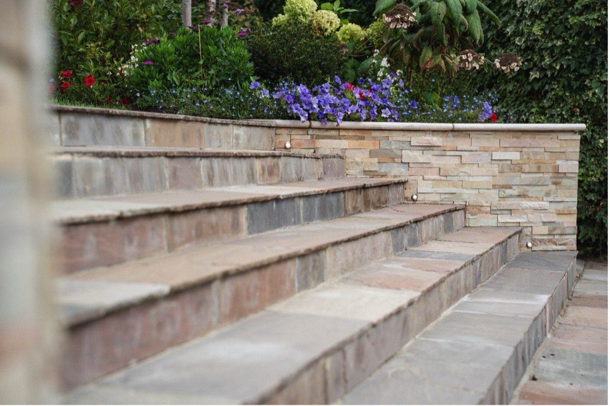 Recessed step and wall lights on sandstone garden steps, installed by Allview