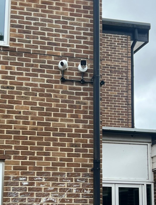 CCTV cameras neatly installed on a brick house
