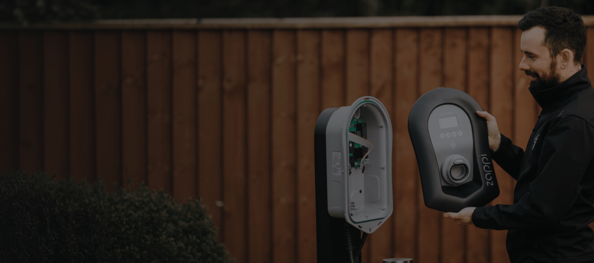 An Allview electrician installing a Zappi EV charger at a home in Kent